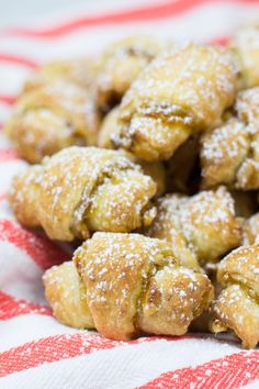 a pile of pastries sitting on top of a red and white towel