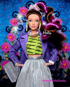 a barbie doll wearing a purple jacket and silver skirt with her hair in a pony tail