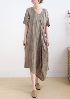 Diy Khaki asymmetrical design V Neck Long Summer Linen DressFabric: Cotton 45%, Linen 55%Size & Fit: Fit: This garment fits true to size.Length: Size L measures 43.68"from shoulder to hemBust: Great for any cup size. Waist: Loose Fit. Comfortable room throughout midsection.Hip: Loose Fit - room for hips. Hand Wash Cold. Casual Beige Midi Dress With Asymmetrical Hem, Casual Linen Dress With Asymmetrical Hem, Casual Solid Color Asymmetrical Midi Dress, Casual Solid Midi Dress With Asymmetrical Hem, Casual Solid Asymmetrical Midi Dress, Asymmetrical Linen Midi Dress, Casual Asymmetrical Linen Dress, Lagenlook Midi Dress With Short Sleeves, Relaxed Fit V-neck Lagenlook Dress