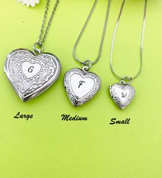 "This is a unique engraving initial on stainless steel heart locket charm on 18 inches stainless steel necklace chain.  I do not put the photo to the locket HOW TO ORDER 1) Select the quantity 2) Select stamp the initial and style  3) Add to cart DESCRIPTION ♥ Necklace, Stainless Stee Chain with Lobster Claw Clasp, Size: about 17.7 inches (45cm) long, 1-2mm wide, Nickel Safe, ♥ LARGE, 304 Stainless Steel Locket Pendants, Photo Frame Charms for Necklaces, Heart, Platinum, Size: about 29mm (1 1/8\") wide, x 29mm (1 1/8\") long, 7mm thick; Fits photo 21mm or 7/8\" (W)x17mm or 5/8\"(H) OR ♥ MEDIUM, 316 Stainless Steel Locket Pendants, Photo Frame Charms for Necklaces, Heart, Stainless Steel Color, Size: about 0.77-inch(19.5mm) wide, 0.89-inch(22.5mm) long, 0.20-inch(5mm), inner (fit photo) dia White Gold Locket Necklace For Valentine's Day Gift, Initial Pendant Locket Necklace With Charms As Gift, Silver Heart Locket Necklace With Charms, White Gold Heart Charm Locket Necklace Gift, Silver Double Heart Jewelry Gift, Silver Round Locket Necklace For Valentine's Day, Silver Locket Necklace For Valentine's Day, White Gold Locket Necklace With Heart Charm For Gift, White Gold Double Heart Locket Necklace For Gifts