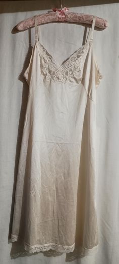 Women's Body Lites brand -vintage 1970's cream colored slip dress with floral lace front looks like a butterfly and lace at the bottom hem, adjustable Ribbon straps! SIZE - 36W/ Medium  * Free Shipping Vintage Pajamas Aesthetic, Spring Wedding Slip Dress With Lace Trim, Vintage Slip Dress For Wedding Night, Beige Slip Dress With Lace Trim For Daywear, Elegant Beige Nightgown For Spring, Vintage Cream Slip Dress, Summer Wedding Nightgown Bias Cut, Vintage Slip Dress For Wedding, Spring Fitted Nightgown With Lace Trim