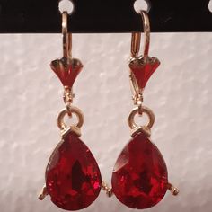 Small red oval crystals dangling on your ear as you go, this design is meant for the person that wants to go all out with a red dress. The pair hangs proportionately and bring more to emphasis to the face. Details Laminated gold Red oval crystal small design Face Details, Small Design, Fancy Color Diamonds, Emphasis, Small Designs, Red Gold, Red Dress, The Face, Pearl Earrings