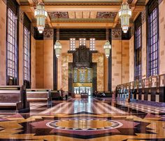 an ornately decorated lobby with chandeliers and marble floors