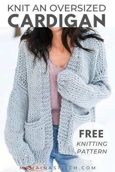 a woman is standing in the snow wearing a gray cardigan sweater and ripped jeans