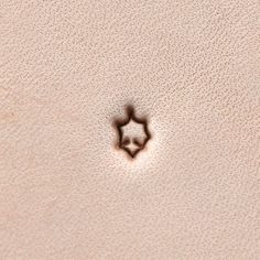 a star shaped object is seen in the sand