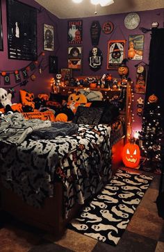 a bedroom decorated for halloween with pumpkins and decorations