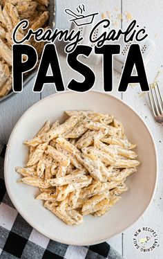 creamy garlic pasta in a white bowl on a checkered tablecloth with text overlay