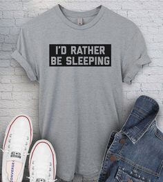 This "I'd Rather Be Sleeping" design is the perfect shirt for anyone that love to sleep more that going out! Crew Neck Sleep Top With Graphic Print, Graphic Print Sleep Tops With Crew Neck, Graphic Print Crew Neck Top For Sleep, Relaxed Fit Crew Neck Sleep T-shirt, Relaxed Fit Crew Neck Sleepwear T-shirt, Short Sleeve Sleep T-shirt With Graphic Print, Short Sleeve Letter Print Sleep T-shirt, Short Sleeve Graphic Print Sleep T-shirt, Comfortable Crew Neck T-shirt For Sleep