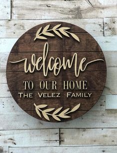 a wooden sign that says welcome to our home