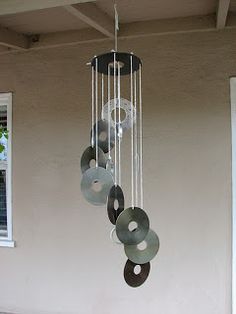 a wind chime hanging from the side of a building