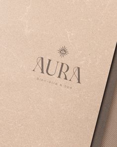 an open book with the word aura written on it's front and back cover