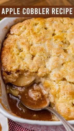 an apple cobbler recipe in a white casserole dish with a serving spoon