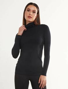 The Butter Long Sleeve Turtleneck in Black by Commando is a fitted top, perfect for layering crafted in their ultra-soft Butter™ fabric. Designed with a flattering high neck and longline silhouette, this turtleneck is constructed with raw-cut edges for a sleek finish. Fit-tested by real women Four way stretch and high recovery Pilling resistant Luxury Austrian modal blend (79% modal, 21% elastane) Sustainably made fabric: PEF, Eco-Tex Standard 100, OekoTex, STep, and REACH certified Machine wash cold Drip dry Do not bleach, iron, or dry clean Personal Style Types, Statement Coat, Hair Accessories Collection, Womens Turtleneck, Fitted Top, Long Sleeve Turtleneck, Drip Dry, Thom Browne, Real Women