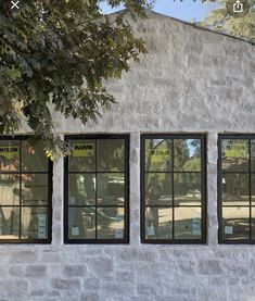 three windows on the side of a building