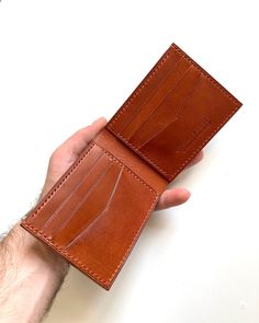 Cognac Bifold Wallet With Coin Pocket, Cognac Bifold Wallet With Interior Card Slots, Leather Bifold Wallet With Leather Lining, Vegetable Tanned Leather Bifold Wallet For Everyday Use, Bifold Wallet In Vegetable Tanned Leather For Everyday Use, Cognac Leather Wallets For Gift, Cognac Bifold Wallet With Smooth Grain, Vegetable-tanned Leather Wallet For Daily Use, Classic Leather Wallet, Vegetable-tanned