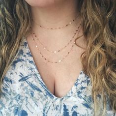 Our Triple Layer Necklace is so delicate and chic. This dainty layered necklace is made with 14K gold filled or Sterling Silver chain which catches the light so beautifully and just sparkles. It's truly a gorgeous piece to add to your collection. It's great to wear with a nice low cut dress or dress it down with jeans & a loose tank top. Either way, you will be getting endless compliments! Low Cut Dress, Triple Layer Necklace, Chain Link Necklace Silver, Loose Tank Top, Delicate Gold Necklace, Delicate Necklaces, Layered Choker Necklace, Loose Tank, Necklace Layered