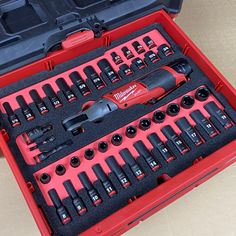 a red tool box filled with black tools