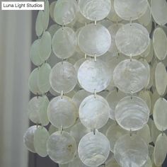 a chandelier made out of glass discs