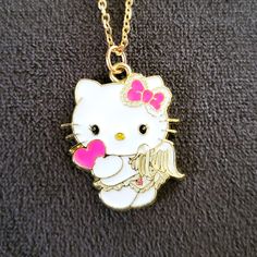 Hello Kitty Angel Necklace Has A 1" White & Pink Sanrio Hello Kitty Pendant & 16" Delicate Golden Zinc Alloy 1.5mm Chain. Hello Kitty Has White Angel Wings, Golden Trim & Pink Bow, And Is Holding A Cute Pink Heart. Adorable, Dainty, And Sweet, Like The Hello Kitty Princess In Your Life, And The One Who Created It. Thebabyteacup.Etsy.Com Hello Kitty Princess, Hello Kitty Angel, Tea Cup Jewelry, Cute Pink Heart, Pink Sanrio, Princess Kitty, Angel Wings Jewelry, White Angel Wings, Angel Cat