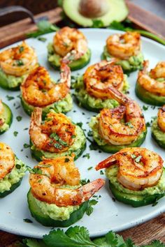 some food that is on top of cucumbers and has shrimp in the middle