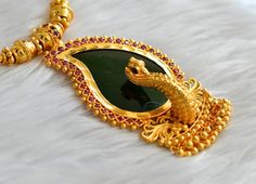 Gold tone kerala style pink-green mango peacock necklace with 23 cm length Elegant Kundan Necklace With Peacock Design For Puja, Diwali Gift Temple Necklace With Peacock Design, Peacock Design Necklaces For Puja And Diwali, Peacock Design Pendant Necklace, Green Necklace With Peacock Design For Diwali, Peacock Design Pendant Necklace For Celebration, Peacock Design Bridal Necklace For Festivals Gift, Peacock Design Bridal Necklace For Festivals, Green Peacock Design Necklace For Diwali