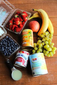 fruits, yogurt, and other foods are on the table