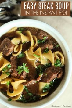 a white bowl filled with beef and noodles