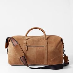 Impeccably crafted from high quality leather or suede, the Graham Leather Collection is filled with classic styles for work and travel. Designed with a place for everything you need for a weekend away, this overnighter features both carrying handles and an adjustable shoulder strap. Add a monogram to for a unique touch.    22"w x 9.75"d x 11"h  Made from leather or suede with a soft cotton lining.  Please see Product Information for more details.  Made in Turkey.  Camel: Monogramming is foil or blind debossed.  Chocolate: Monogramming is foil debossed. Leather Briefcase Bag, A Place For Everything, Work And Travel, Mark And Graham, Leather Artisan, Leather Laptop, Rustic Brown, Leather Briefcase, Brown Bags