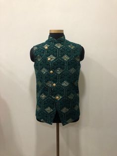 Embroidered Asymettric Nehru Bundi Jacket With Hints Of Sequence Work. Pair This with your existing kurta pajamas. Material-Infused Georgette Pattern-Chikankari Embroidery Style-Asymmetric Product- Bundi Jacket Sizes 30,32,34,36,38,40,42,44,46,48,50,52,54 Luxury Nehru Jacket With Buttons For Wedding, Luxury Fitted Nehru Jacket With Embroidered Sleeves, Luxury Off White Nehru Jacket For Reception, Elegant Luxury Beige Nehru Jacket, Luxury Chanderi Nehru Jacket For Festive Occasions, Luxury Designer Nehru Jacket For Fall, Luxury Tailored Nehru Jacket For Designer Wear, Luxury Classic Nehru Jacket With Buttons, Luxury Sleeveless Nehru Jacket For Festive Season