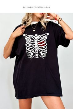 Step up your Valentine's style with our ribcage drawing graphic t-shirt! 🖤💖 This cute tee unveils a heart, bringing an edgy charm to your outfit. Crafted for comfort and fashion, our graphic tees are a must-have for women setting trends. 🌟 Grab yours now! #GraphicTees #ValentinesDay #RibcageDrawing #CuteGraphicTees #TShirtsForWomen #OutfitInspiration Rib Cage Drawing, Single Quotes Funny, Single Quotes, Cute Graphic Tees, Valentine's Day Outfit, Heart Candy, Funny Love, Valentines Shirt, Rib Cage