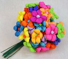 a bouquet of colorful flowers on a white surface