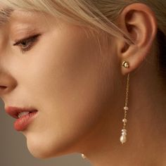 This elegant and timeless pearl Jewelry is perfect for daily wear. It's also an ideal gift for your loved one. 👑Dimensions: -Earring Length: 7.5cm -Stone size:  Freshwater pearl 6mm-4.5mm -Material: 14K Gold Filled Silver studs 👑Note: Please note that due to the nature origin of stones, the color and shapes will slightly vary. 👑Packaging: All Items come with an elegant jewelry box. Please leave message for special gift wrapping( For example if you want to package a whole set in one box). 👑Care: To protect you jewelry, please remove your jewelry before bathing and swimming, and avoid exposure to chemicals. ❤If you have any question about this item please feel free to contact me. ❤Thank you so much for visiting and hope you enjoy shopping with us! Pearl Earrings With Pearl Chain As Gift, Pearl Chain Earrings As A Gift, Pearl White Earrings With Pearl Chain As Gift, Gold Linear Earrings With Pearl Pendant Gift, Teardrop Pearl Chain Earrings As Gift, Long Drop Linear Earrings With Pearl Charm As Gift, Long Drop Pearl Earrings As Gift, Pearl Long Drop Earrings For Gifts, Pearl Long Drop Linear Earrings As Gift