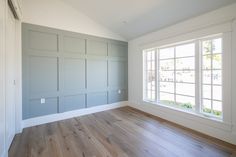 an empty room with wood floors and white paint on the walls is pictured in this image