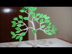 a paper tree with green leaves on it