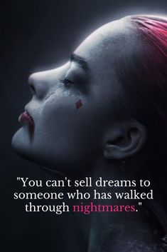 a woman with red hair and makeup is looking down at her face, the words you can't sell dreams to someone who has walked through nightmares