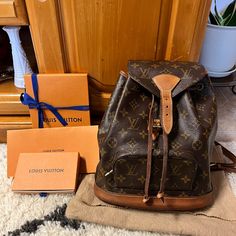 This Is The Authentic Louis Vuitton Monogram Montsouris Mm Backpack. This Refined Backpack Is Crafted Of Monogram Coated Canvas. The Backpack Features Vachetta Leather Trim, Base, Shoulder Straps, And Cinch-Cord. The Bag Also Includes Brass Hardware, An Exterior Zipper Pocket, And A Flap With A Vachetta Leather Belt Closure. Good Condition. Deep Patina And Watermarks Throughout Vachetta Leather (Bottom Part-Base), Super Light Scuffing Trim On The Opening, And Tarnishing On The Hardware. Length: 10" (25 Cm) Height: 11" (27 Cm) Depth: 5" (12 Cm) Date Code: Sp0959 Designer Brown Bag With Original Box, Pre-owned Brown Monogram Canvas Bag, Luxury Pre-owned Brown Bag, Pre-owned Designer Brown Bags, Pre-owned Monogram Canvas Bag For Daily Use, Pre-owned Monogram Canvas Bags For Everyday Use, Vintage Brown Signature Coated Canvas Bag, Vintage Travel Bag In Signature Coated Canvas, Designer Pre-owned Travel Bags