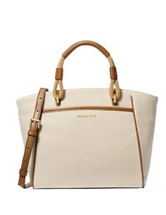 Classic Canvas Tote bagCotton canvasGold-tone hardware13.5”W X 8.9”H X 4.25”DHandle drop: 3.5”Adjustable strap: 20.5”-24”Exterior details: front slip pocketInterior details: back zip pocket, 2 front slip pocketsLining: 100% polyesterSnap fasteningColor: Natural Luggage Canvas Shoulder Bag With Top Handle And Branded Hardware, Canvas Double Handle Bag With Branded Hardware, Canvas Bag With Branded Hardware And Double Handles, Chic Canvas Bags With Branded Hardware, Double Handle Canvas Bag With Branded Hardware, Canvas Bag With Double Handle And Branded Hardware, Canvas Satchel With Gold-tone Hardware For Travel, Travel Canvas Satchel With Gold-tone Hardware, Elegant Canvas Shoulder Bag With Branded Hardware