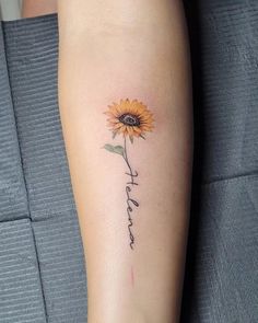 a sunflower with the word faith written on it's lower arm is shown