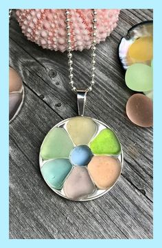 One of a kind seaglass necklaces made from seaglass collected on beaches. These seaglass necklaces feature natural variations that make every seaglass jewelry piece a special find. Follow the link to beachblissdesigns.com to learn more about these gorgeous seaglass jewelry and find shopping links. Seaglass Necklaces, Sea Glass Mosaic, Seaglass Jewelry, Sea Glass Necklace, Glass Mosaic