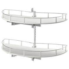 two white circular shelves with metal railings on each side and one above the other