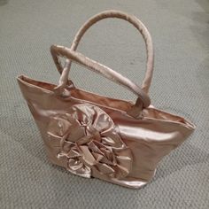 Vintage 1980s - Women's Lightweight, Satiny, Light Bronze Handbag. Large Flower Design On The Front; Two Drop Handles, Interior Zippered Pocket, Two Open Pockets And Top Zippered Enclosure. Will Fold Flat For Traveling Or Storage When Not In Use. New - Never Used. Smoke And Fragrance Free Home. 1980s Women, Fragrance Free, Large Flowers, See Pictures, Flower Design, Fragrance Free Products, See Picture, Ruler, Flower Designs