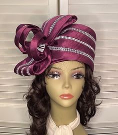 "Amazing vintage wine satin toque embellished with rhinestone roping. The large satin bow sits on the side with additional satin loops and a jeweled center. Crown 4\" Size 22.5" Elegant Wedding Hats With Satin Bow, Elegant Evening Hat With Satin Bow, Formal Fitted Hats With Ribbon, Elegant Formal Mini Hats With Ribbon, Kentucky Derby Party Hat With Satin Bow, Elegant Party Hat With Satin Bow, Kentucky Derby Formal Fascinator With Satin Bow, Kentucky Derby Satin Bow Fascinator, Elegant Hat With Satin Bow For Party