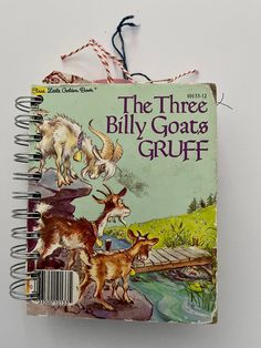 the three billy goats gruff book is hanging from a string on a wall