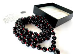 Handmade in Rochester Hills - Michigan, using only high quality natural 8MM black Onyx gemstones that are sourced ethically (and we put extra effort to keep it that way ). WATERPROOF, ADJUSTABLE and  KNOTTED between each bead.  We ship within 1-2 business days. * Gemstone: Black Onyx * Bead size: 8 mm * Circumference Length: 39 inches + 2 inches adjustable * Number of gemstones: 108 beads + 1 guru bead * Knotted * Wear this Mala as a bracelet or as a necklace. Gemstone description card included. Black Beaded Bracelet With 108 Beads For Meditation, Spiritual Black Beaded Necklaces With Round Beads, Black Spiritual Beaded Necklace With Round Beads, Black Polished Beads Necklace For Meditation, Adjustable Black Beaded Necklaces With 8mm Beads, Black 108 Beads Jewelry Gift, Hand-strung Black Beaded Necklaces, Adjustable Black Beads For Gifts, Gift Onyx Beaded Necklaces