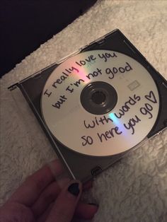 someone is holding up a cd that has been written on it with the words i really love you, but i'm not good