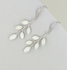 Similar design with more leaves and branches: https://www.etsy.com/listing/626875120/vine-earrings-silver-wedding-earrings?ref=shop_home_active_9&pro=1&frs=1 materials: Swarovski white opal crystal, cubic zicornia paved ear wires, tarnish resistant wires. Sizes: full length approx 4.5cm . very light weight. Color: Available in Gold, Silver and Rose Gold. Please choose a color when you place order. This piece will be shipped out in 3-6 working days *Back to my storefront: http://www.etsy. Vine Earrings, Boho Bridal Jewelry, Boho Wedding Earrings, Silver Bridal Earrings, Wedding Chandelier, Opal Wedding, Ivory Earrings, Rose Gold Crystal, Earrings Rose Gold