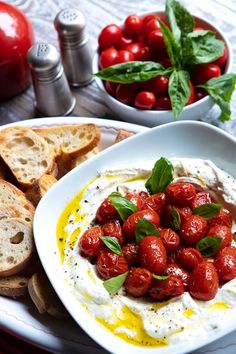 there is a plate with bread and tomatoes on it