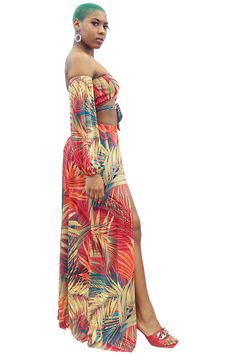 This is a multi-functional, off-shoulder 2-piece maxi skirt set/cover-up that features two deep side splits, long loose puffer sleeves, and a front tie. The maxi skirt has under panties attached. Multicolor tropical pattern. Size range from small to 2x. Great for poolside/vacation wear. Two-piece Long Skirt Dress For Vacation, Off-shoulder Beach Sets For Spring, Off-shoulder Summer Vacation Sets, Summer Off-shoulder Vacation Sets, Beach Maxi Skirt With Side Slits, Vacation Maxi Skirt With Side Slits, Bohemian Two-piece Maxi Dress, Summer Vacation Maxi Length Sets, Maxi Skirt Set