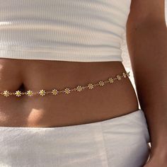 18K Gold Daisy Waist Chain Our chic and refined petite belly chain has a gleaming 18K gold-plated chain with beads. It will quickly improve your appearance and look wonderful with any crop tops or swimwear. Also, it may be put over clothing to give your look a 2000s touch. It will fit snugly around your waist and end up being your go-to summer mate.Waist chains have been used for at least 4,000 years, and they first appeared in the Indian Subcontinent. In the past, both men and women in India us Belly Chain Outfit, Waist Chain Indian, Beaded Belly Chain, Hip Chain, Initial Jewelry Necklace, Chains Aesthetic, Waist Jewelry, Indian Subcontinent, Anklets For Women