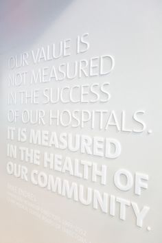 the words on the wall are written in different languages and colors, including one that reads our value is not measured in the success